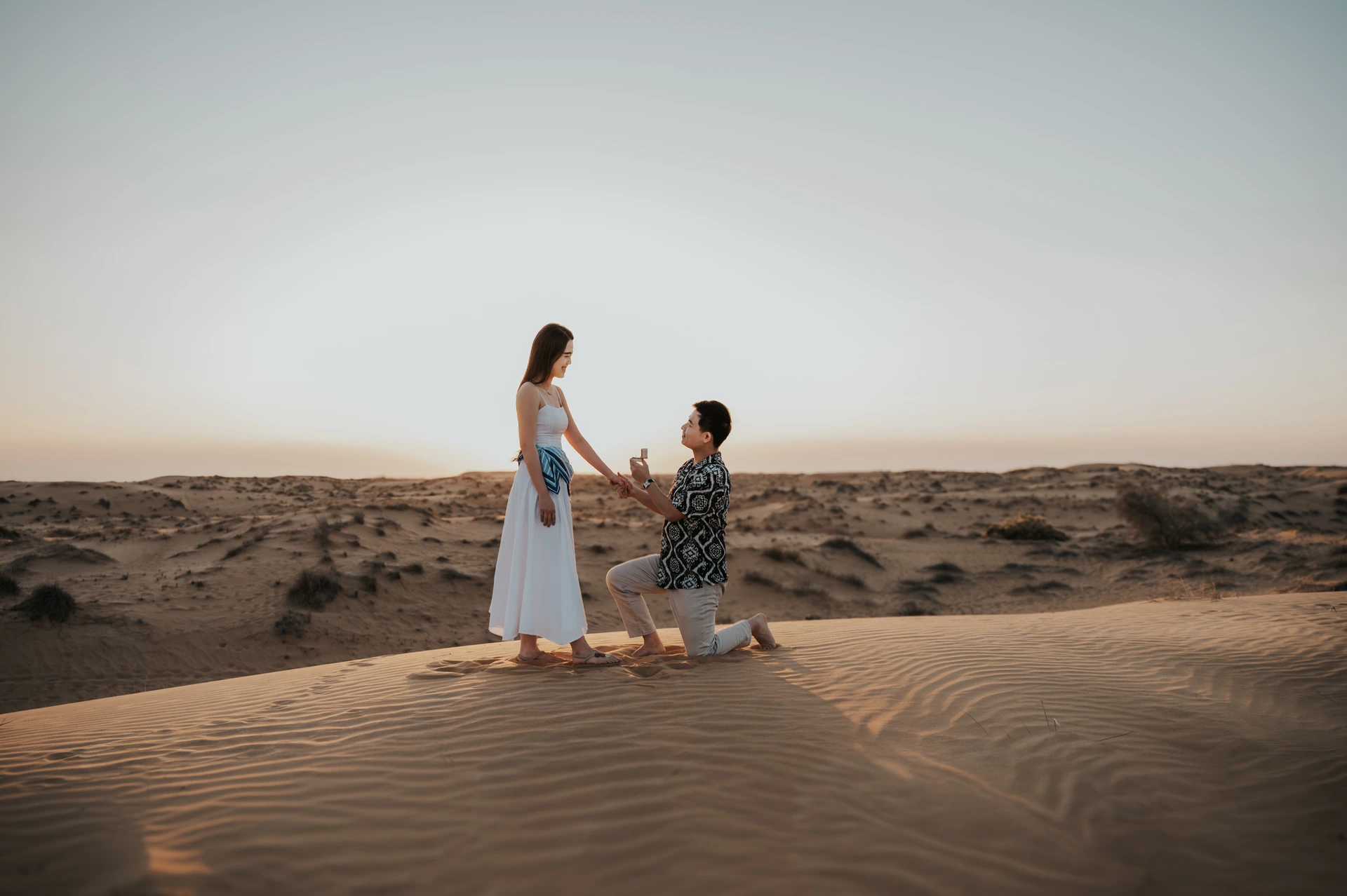 A photoshoot on top of a dune in the desert of Dubai